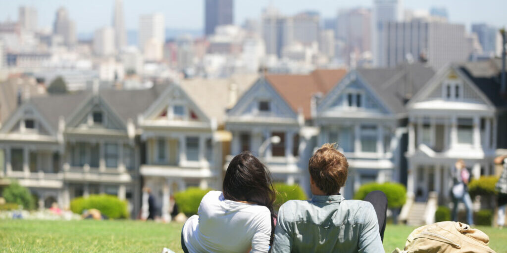 "San Francisco - Alamo Square people. Couple in Alamo Park by the Painted Ladies, The Seven Sisters, San Francisco, California, USA.Click on the banners for more:"